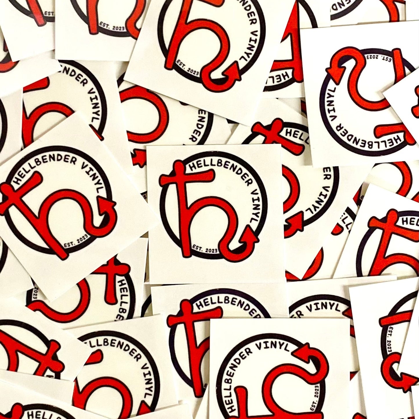 Multiple stickers with a red and black logo and text on a white background