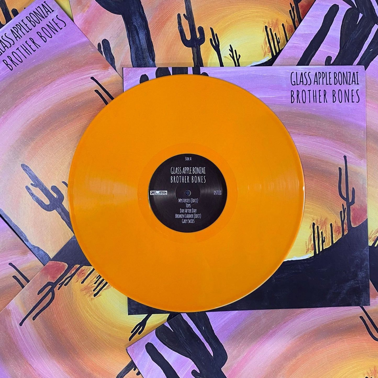 12" orange vinyl record made for an independent band by Hellbender Vinyl