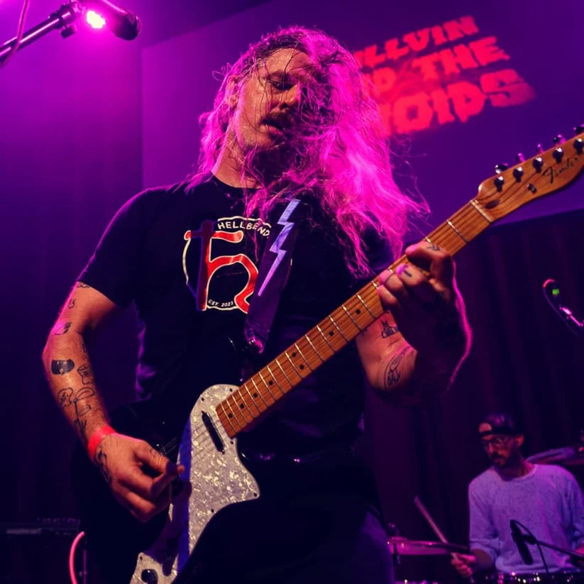 Guitar player from Millvin and the Etnoids wearing a Hellbender Vinyl t-shirt