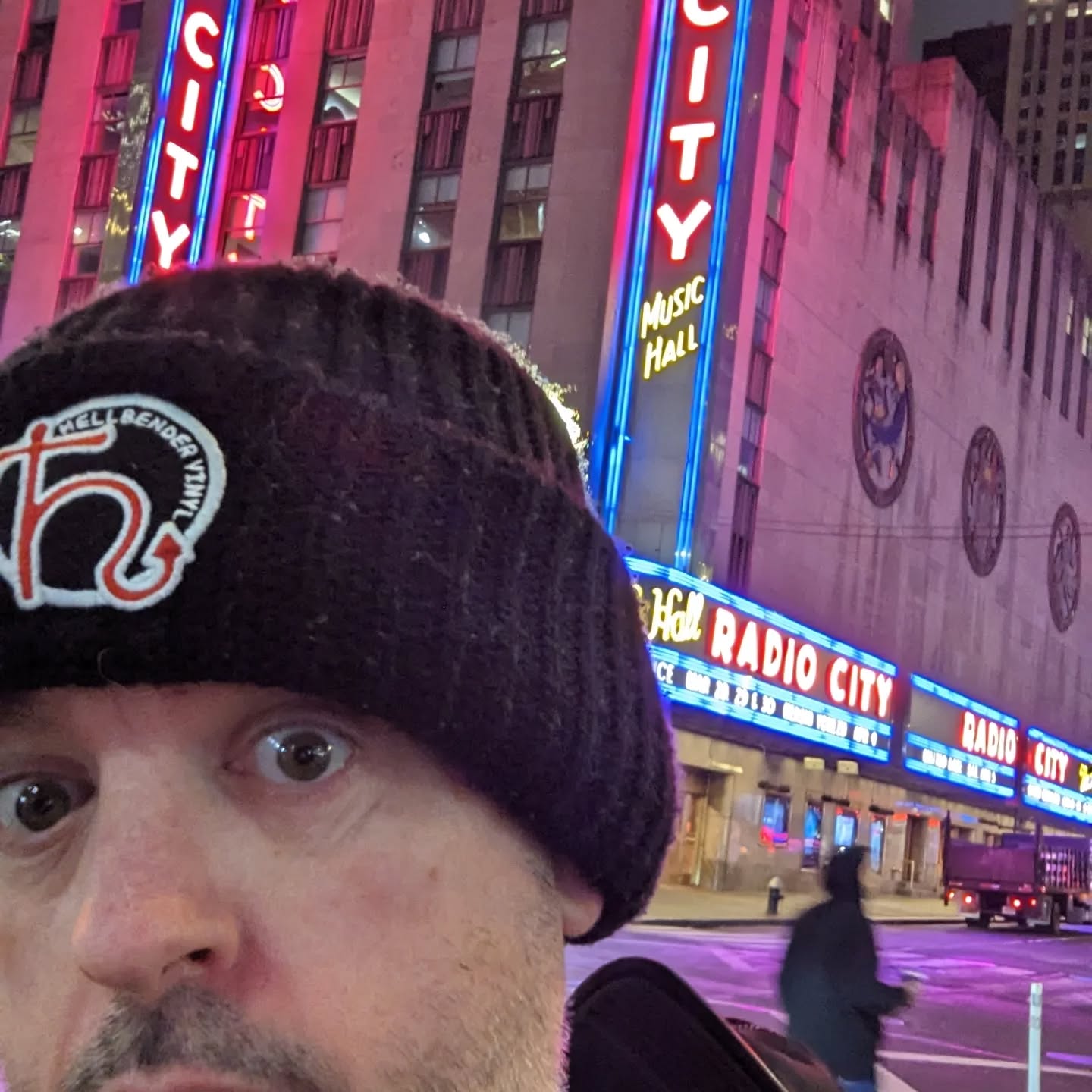 Man wearing a Hellbender Vinyl beanie