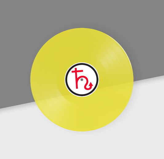 A clear yellow 12-inch vinyl record with a red and black label in the center, placed on a gray and white background.