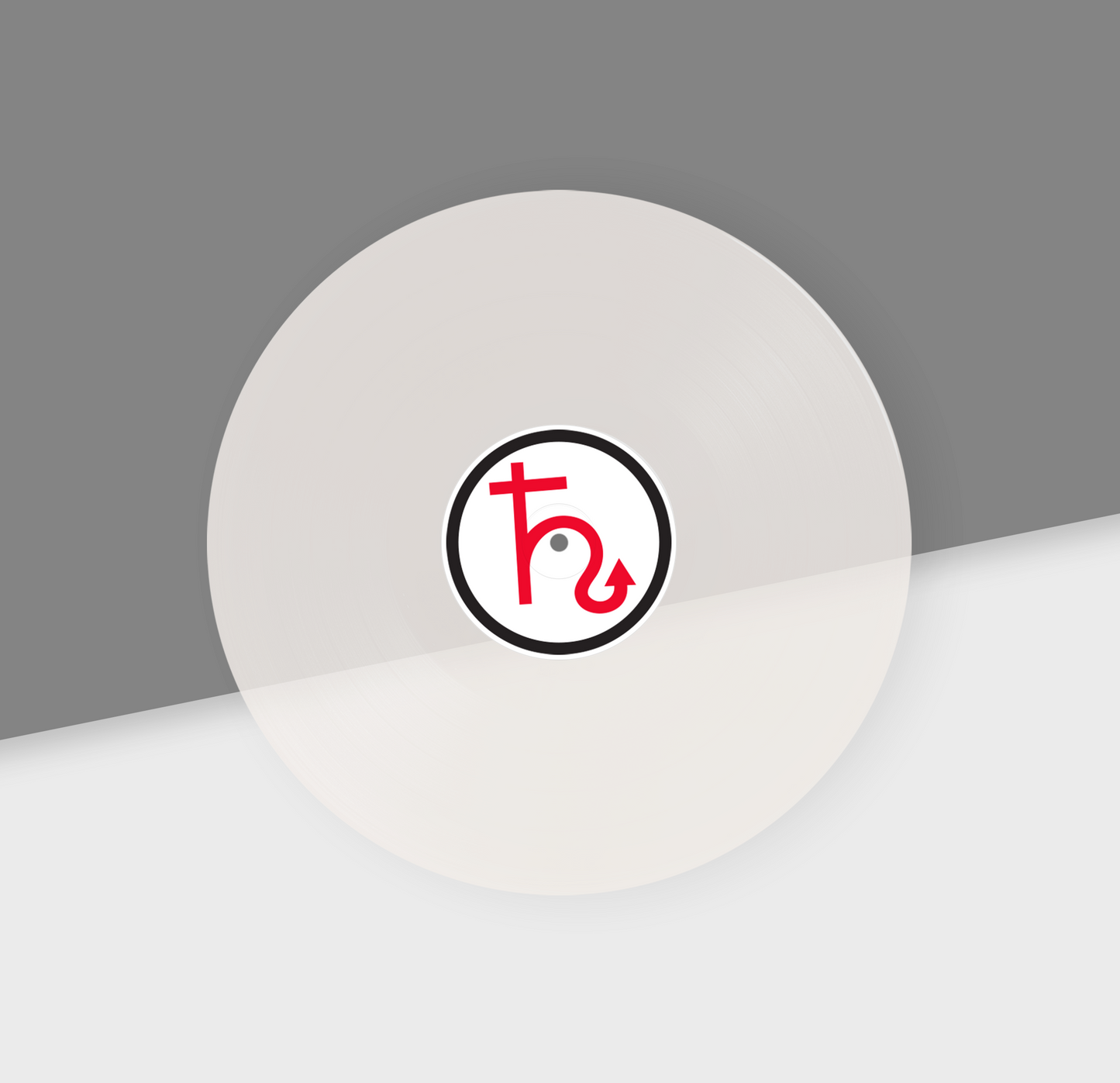 A white 12-inch vinyl record with a red and black center label featuring a symbol, placed on a grey background.