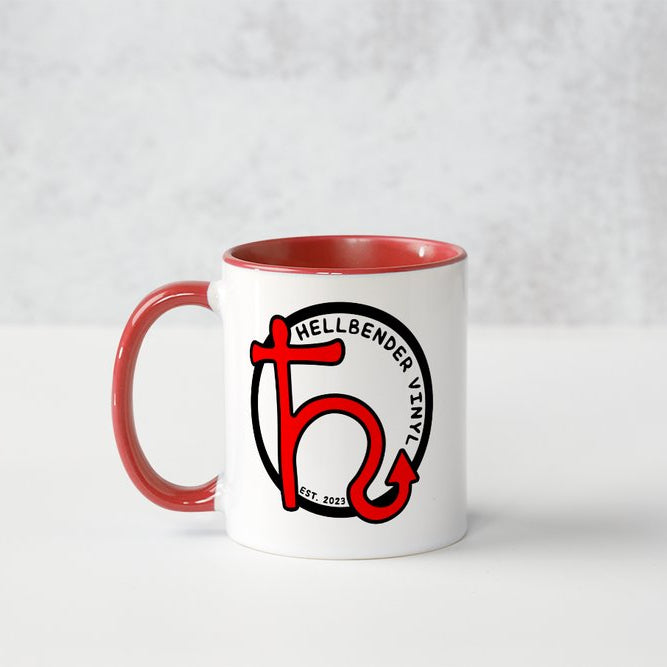 White mug with red interior and handle featuring a logo on a white background