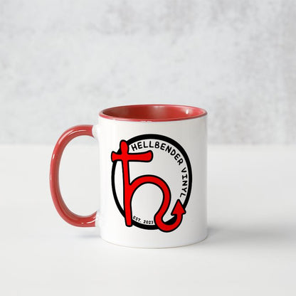 White mug with red interior and handle featuring a logo on a white background