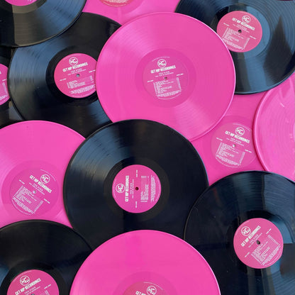 A 12" opaque pink vinyl record pressed by Hellbender Vinyl
