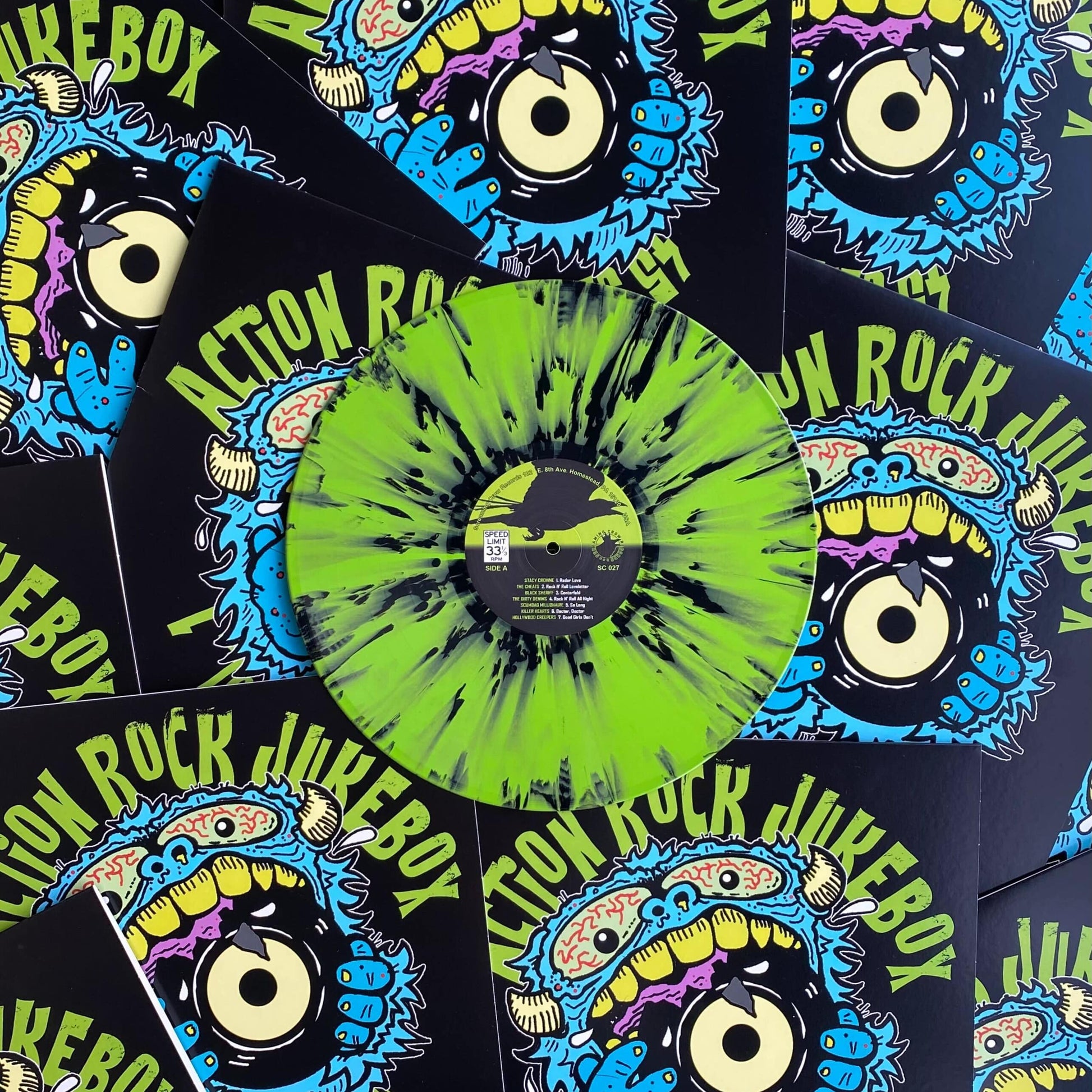 Vinyl record with colorful sleeve design featuring 'Action Rock Jukebox' text and graphics.