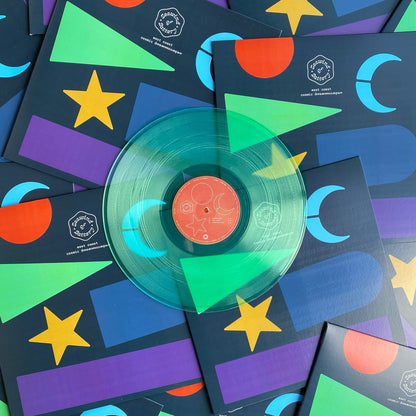 A 12" coke bottle clear vinyl record pressed by Hellbender Vinyl