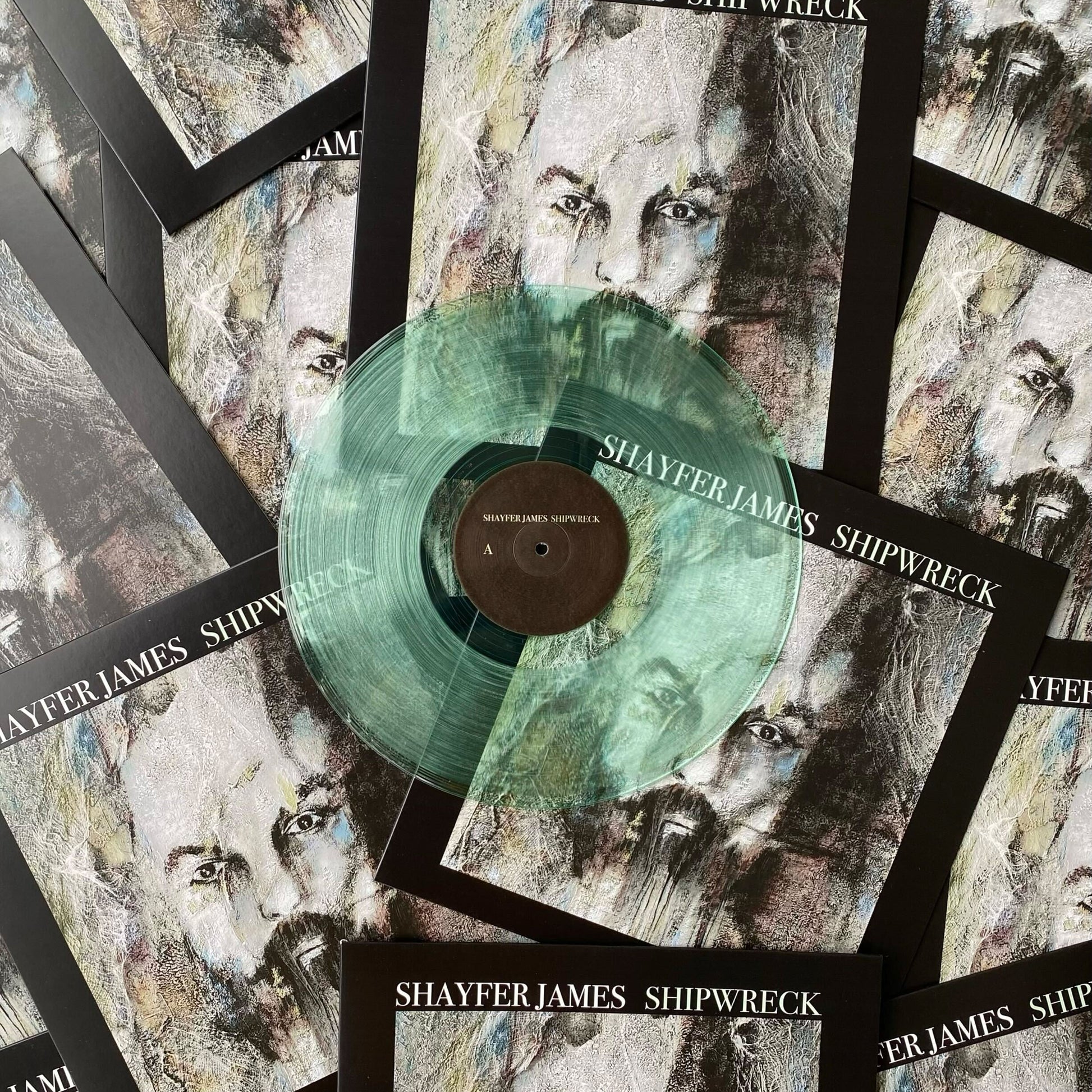 A 12" coke bottle clear vinyl record pressed by Hellbender Vinyl