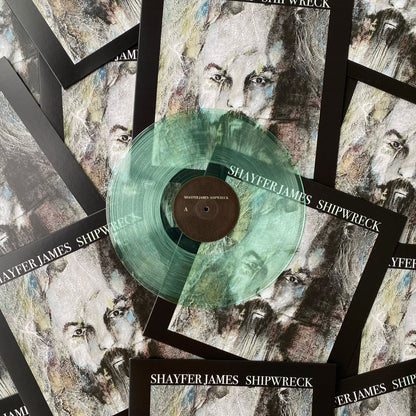 A 12" coke bottle clear vinyl record pressed by Hellbender Vinyl