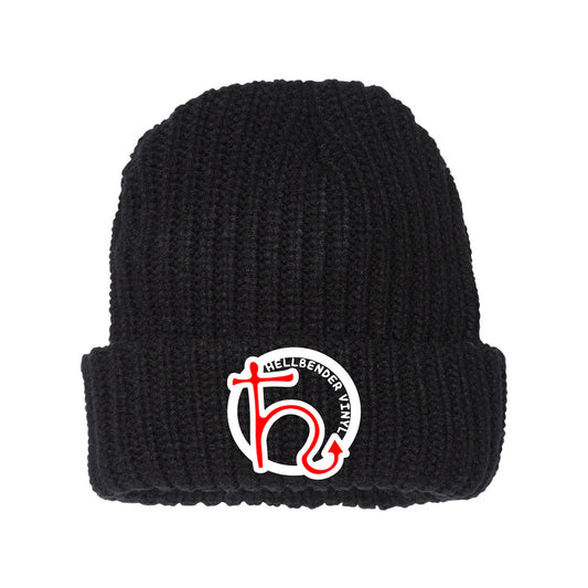 A black chunky knit beanie with a logo on the cuff.