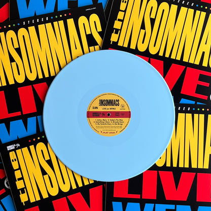 Sky blue vinyl record with a yellow label on a colorful 'The Insomnias' background
